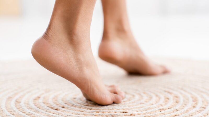 Close up healthy soft woman`s feet. Barefoot. Cares about a woman's clean and soft foot skin.