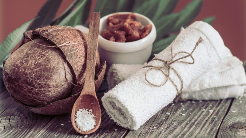 Spa and wellness setting with flowers and towels.