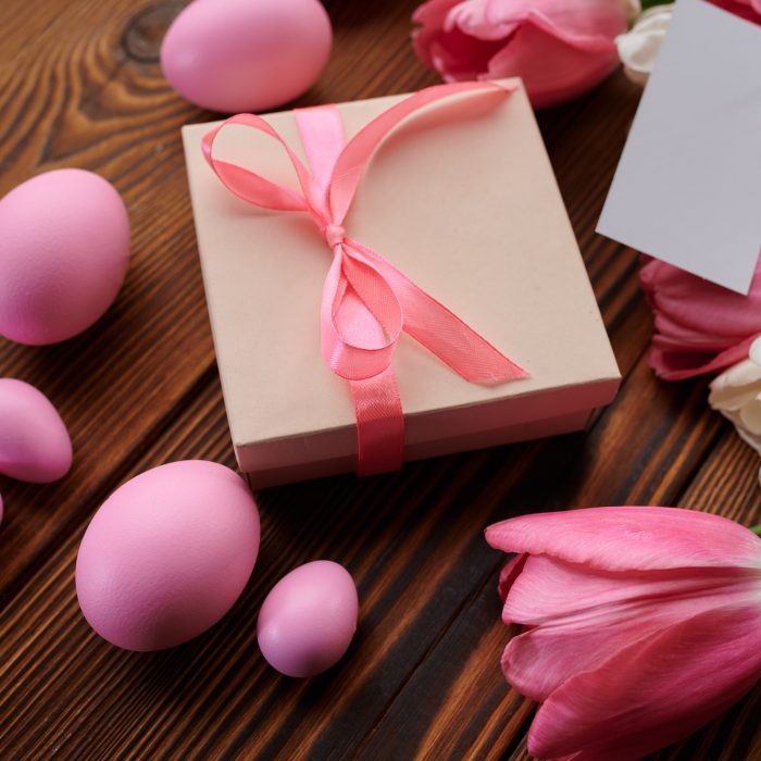 Pink tulips, easter eggs and gift box